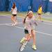 Alyssa Roopas of Pioneer girls tennis team retunes the ball  during practice Thursday night.
Courtney Sacco I AnnArbor.com 